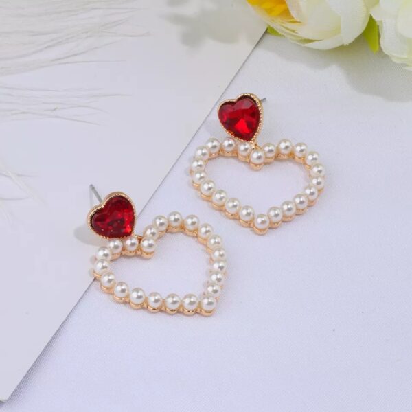 Aretes corazon rojo con perlas Alala