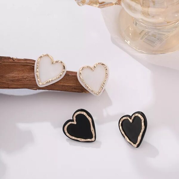 Aretes de corazon blanco con dorado Alala